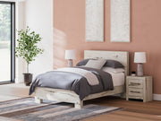Ashley Furniture Lawroy Bed with a modern frame, featuring a sleek headboard and neutral-toned bedding for a stylish bedroom look.