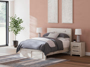 Ashley Furniture Lawroy Panel Storage Bed with sleek design and built-in storage drawers, showcasing a modern bedroom centerpiece.