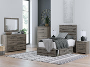 Graystorm bed with storage drawers by Ashley Furniture, showcasing a modern gray bed frame with built-in storage compartments.