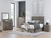 Graystorm bed with integrated storage drawers by Ashley Furniture, featuring a modern design and plush gray upholstery.