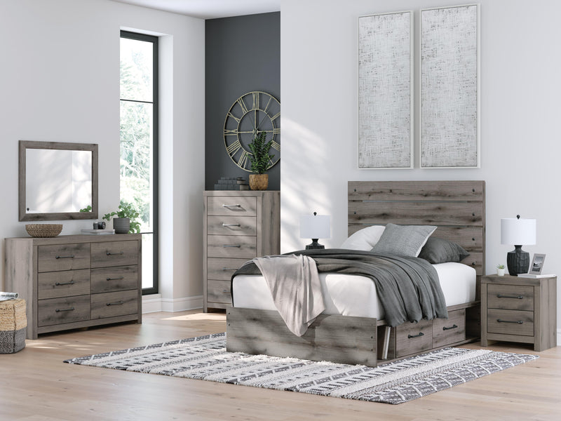 Graystorm bed with integrated storage drawers by Ashley Furniture, featuring a modern design and plush gray upholstery.