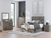 Graystorm bed with storage by Ashley Furniture featuring a modern gray upholstered frame and built-in storage drawers.