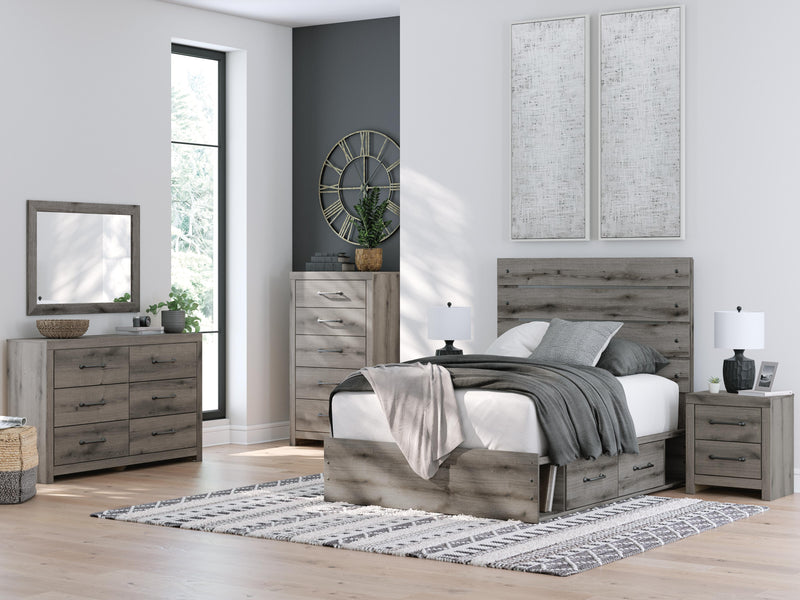 Graystorm bed with storage by Ashley Furniture featuring a modern gray upholstered frame and built-in storage drawers.