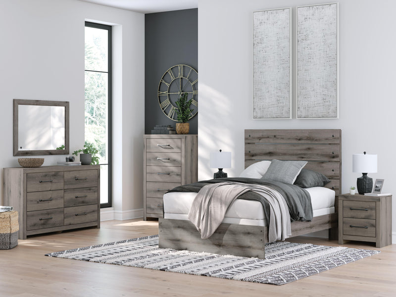 Graystorm dresser and mirror by Ashley Furniture, featuring a modern gray finish with sleek hardware and spacious drawers.