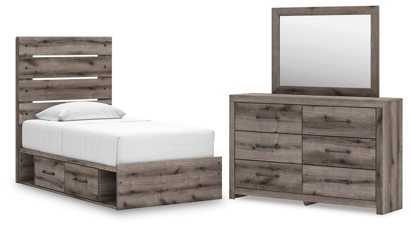 Graystorm bedroom set by Ashley Furniture featuring a bed with a gray upholstered headboard and matching nightstands.