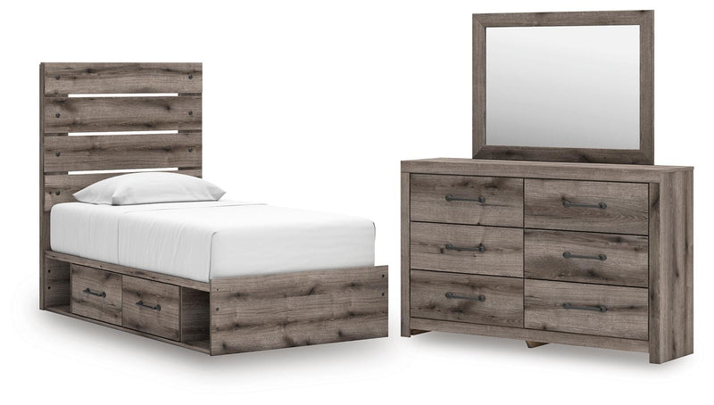 Graystorm bedroom set by Ashley Furniture featuring a gray upholstered bed frame and matching nightstands in a modern bedroom setting