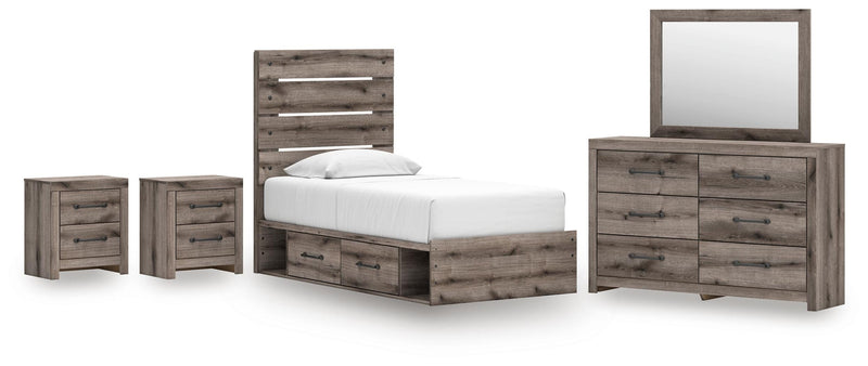 Graystorm bedroom set by Ashley Furniture featuring a bed, matching nightstands, and dresser in a modern gray finish.