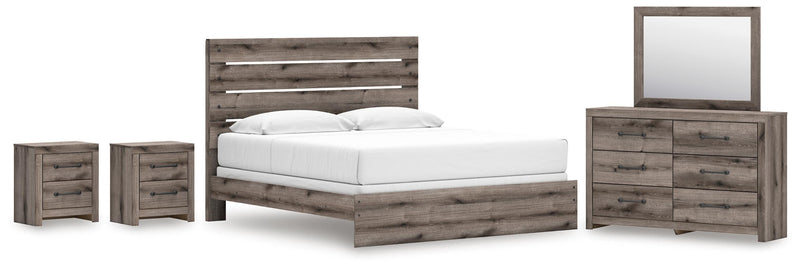 Graystorm bedroom set by Ashley Furniture, featuring a bed, nightstands, and dresser in a modern gray finish.