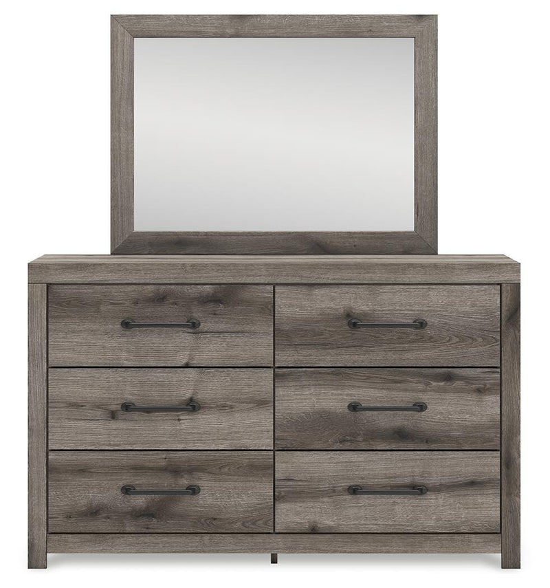 Graystorm bedroom set by Ashley Furniture, featuring a modern bed frame and matching nightstands in a cozy bedroom scene.