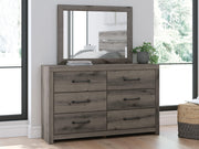 Graystorm dresser and mirror by Ashley Furniture featuring a modern gray finish and sleek design for bedroom storage.