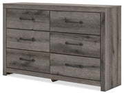 Graystorm dresser and mirror set by Ashley Furniture, featuring a modern gray finish and sleek design, shown from an angled view.
