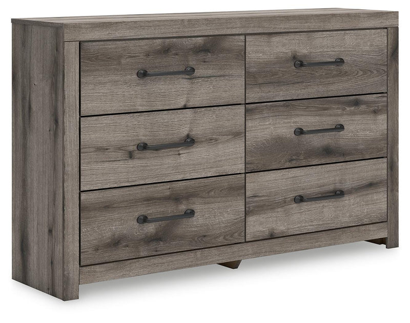 Graystorm dresser and mirror set by Ashley Furniture, featuring a modern gray finish and sleek design, shown from an angled perspective.