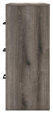 Graystone dresser with matching mirror from Ashley Furniture, featuring multiple drawers and modern design.