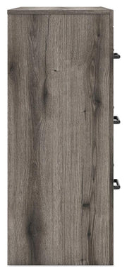 Graystorm dresser with matching mirror from Ashley Furniture, featuring sleek gray finish and modern design.