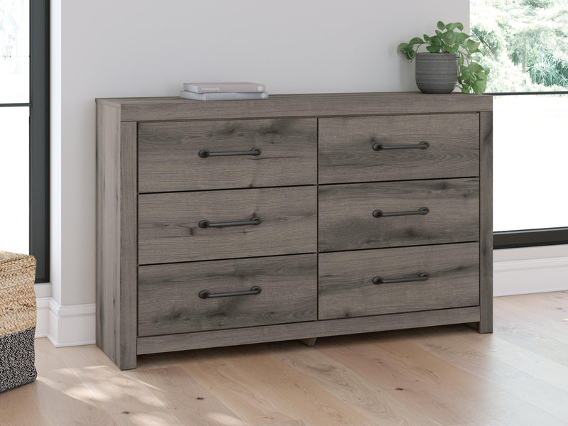 Gray Ashley Furniture dresser and mirror set with sleek design, featuring ample storage and a matching mirror for a modern bedroom look.