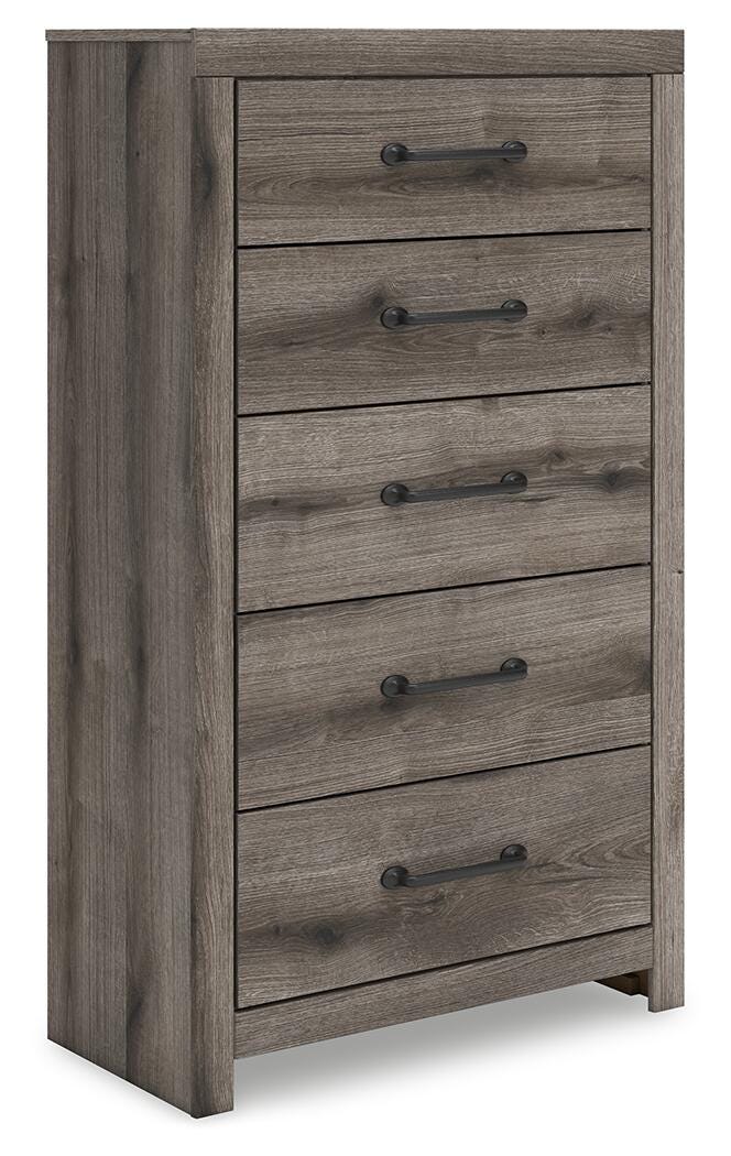 Graystorm chest of drawers by Ashley Furniture, angled view showing sleek gray finish and multiple storage drawers.