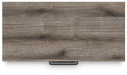 Graystorm chest of drawers by Ashley Furniture, featuring a sleek gray finish and modern storage design.