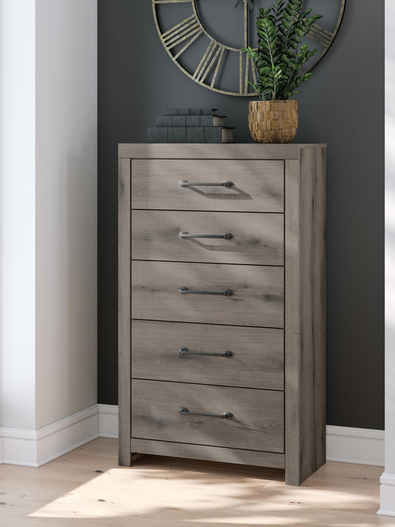 Graystorm chest of drawers by Ashley Furniture, showcasing a contemporary gray wood finish with multiple storage drawers.