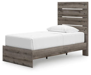 Graystorm Ashley Furniture bed with storage, showcasing the bed frame, headboard, and built-in storage drawers in a bedroom setting.