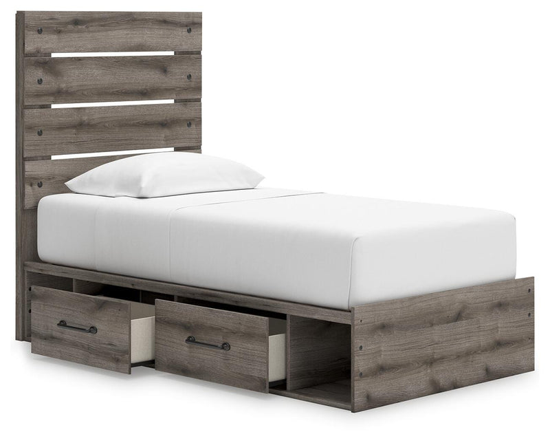 Angle view of Ashley Furniture Graystorm Bed with storage, showcasing the open bed frame and built-in storage compartments.