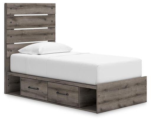 Graystorm Bed with Storage by Ashley Furniture, showing the modern gray upholstered bed frame with built-in storage drawers.
