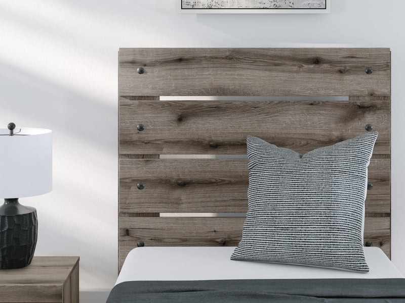Graystorm bedroom set by Ashley Furniture, featuring a modern bed frame and matching nightstands in a sleek gray finish.
