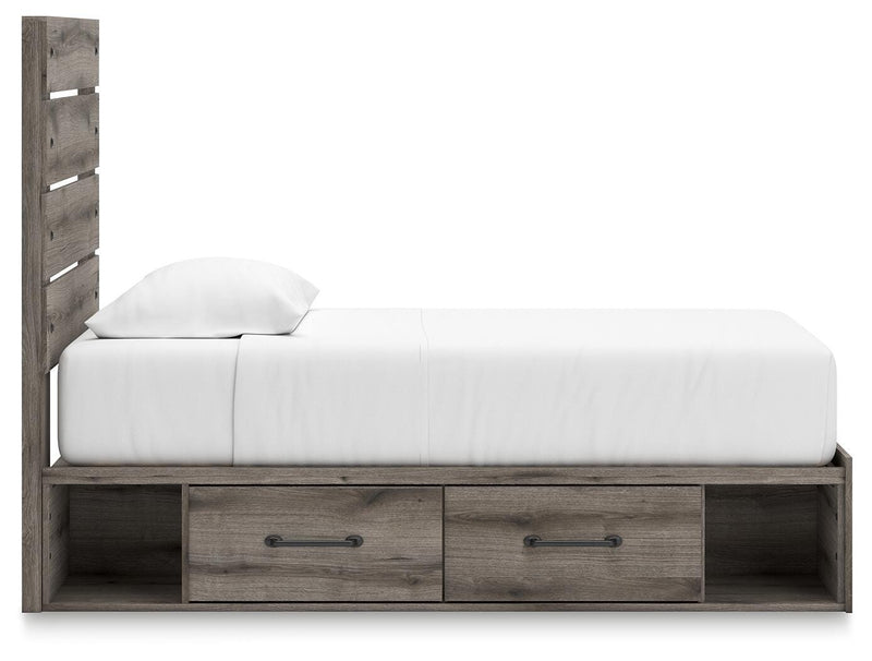 Graystorm bedroom set by Ashley Furniture, featuring a contemporary bed frame and matching bedside tables in a modern bedroom scene.