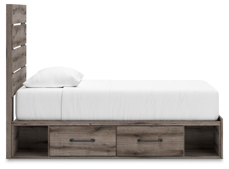 Graystorm Ashley Furniture bed with built-in storage drawers and upholstered headboard, shown from side view.