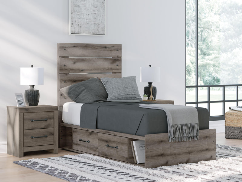 Graystorm bed with storage by Ashley Furniture, featuring a modern gray bed frame with built-in storage drawers.
