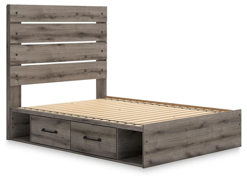 Graystorm storage bed by Ashley Furniture shown from an angle with built-in storage drawers and a modern gray finish.