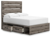 Graystorm bed with storage from Ashley Furniture, shown in an angled open view highlighting the bed frame and storage compartments.