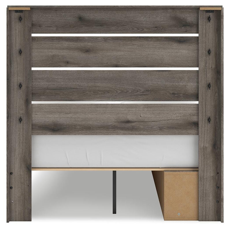 Graystorm Ashley Furniture bed with built-in storage drawers and a modern design, shown in a bedroom setting.