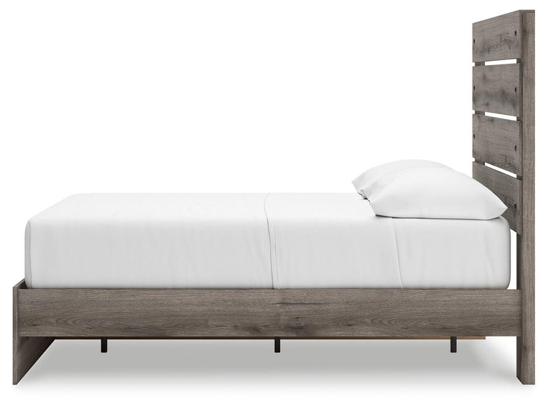 Graystorm Bed with Storage by Ashley Furniture, showing a modern gray bed frame with built-in storage drawers underneath.