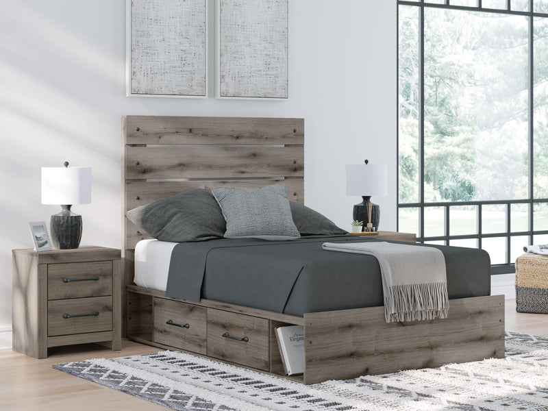 Graystorm bed with storage drawers by Ashley Furniture, featuring a modern gray finish and built-in under-bed storage.