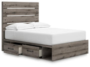 Graystorm Bed with Storage by Ashley Furniture, angled open view showing the bed frame and built-in storage drawers.