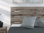 Graystorm Bed with Storage from Ashley Furniture featuring a modern gray upholstered bed frame with built-in storage drawers.