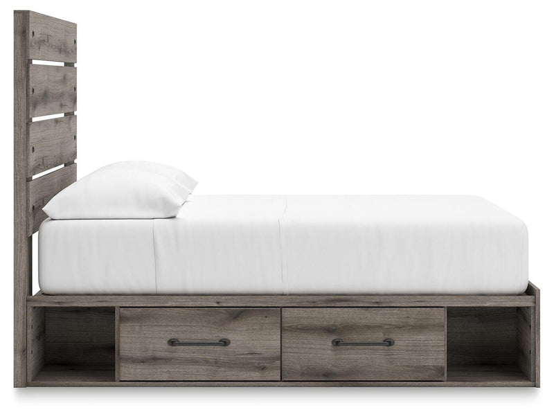 Graystorm bed with storage drawers from Ashley Furniture, featuring a modern gray finish and a sturdy frame with built-in storage.
