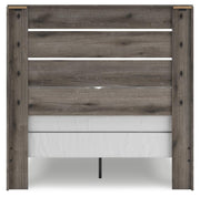 Graystorm Bedroom Set by Ashley Furniture, featuring a modern bed frame and matching bedroom furniture, shown from the back.