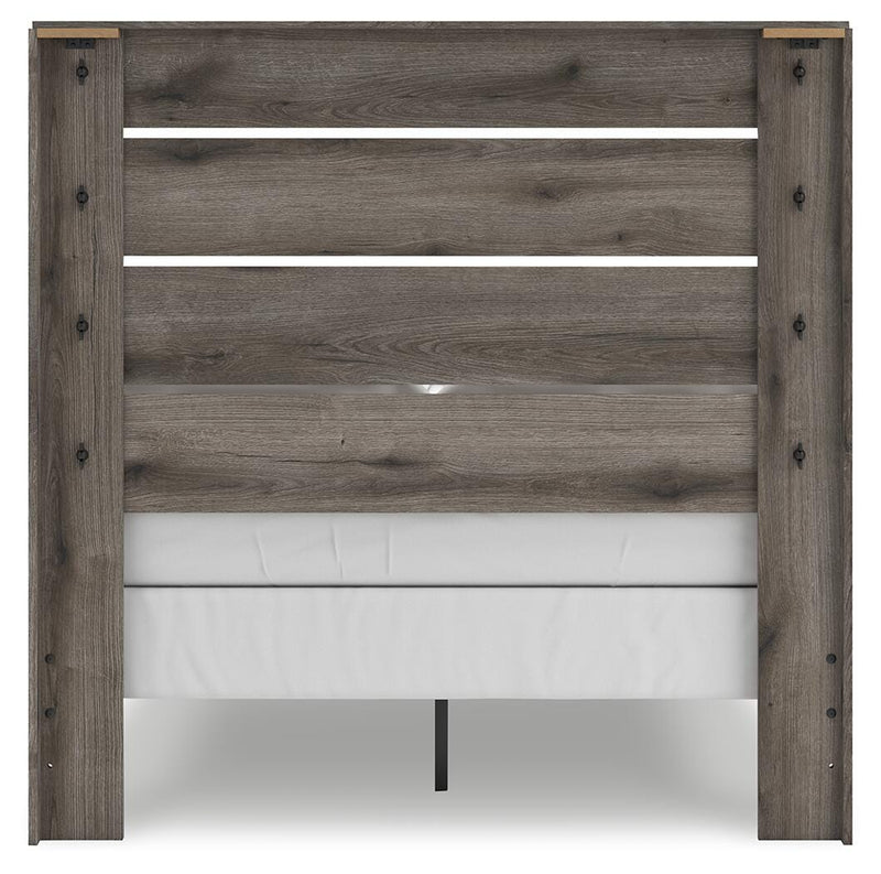 Graystorm Bedroom Set by Ashley Furniture, featuring a modern bed frame and matching bedroom furniture, shown from the back.