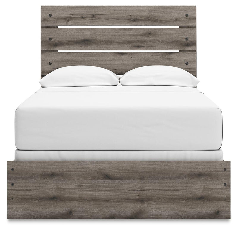 Graystorm bedroom set by Ashley Furniture featuring a modern bed with matching nightstands and a cozy, stylish bedroom design.