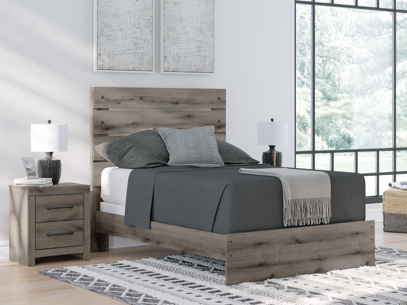 Graystorm bedroom set by Ashley Furniture featuring a modern bed frame, matching nightstands, and a coordinated dresser.