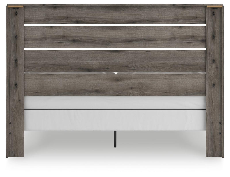 Graystorm bedroom set by Ashley Furniture, featuring a modern bed frame and matching furniture, shown from the back view.