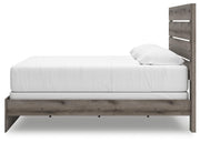 Ashley Furniture Graystorm bedroom set featuring a stylish bed frame with matching nightstands and storage drawers.