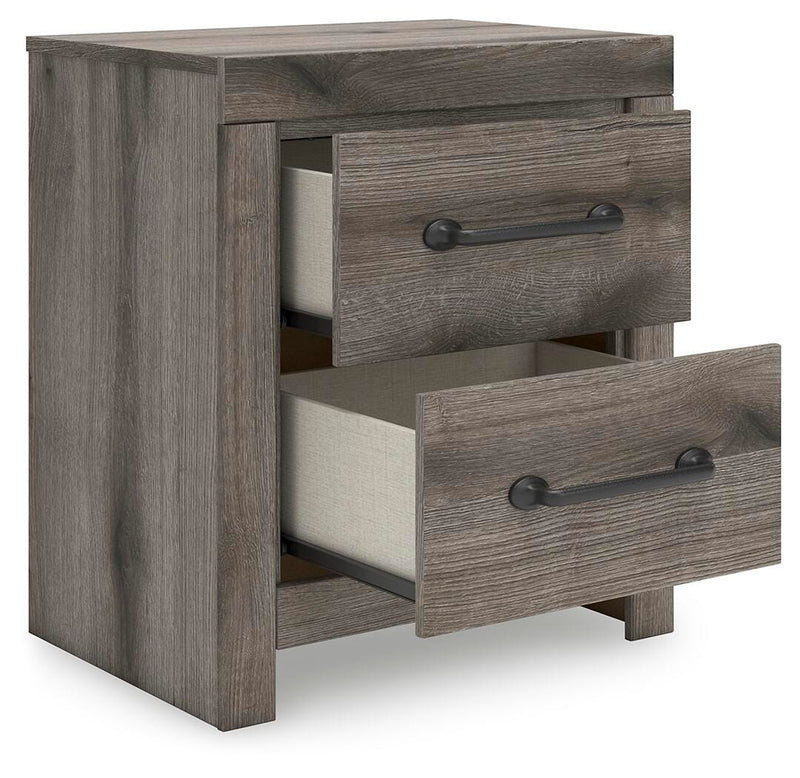 Graystorm bedroom set by Ashley Furniture featuring a bed, matching nightstands, and dresser in a modern gray finish.