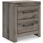 Graystorm bedroom set from Ashley Furniture, featuring a modern bed frame, matching nightstands, and a stylish dresser.