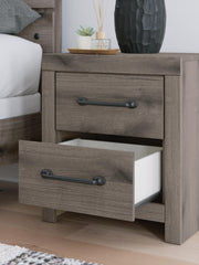 Close-up of Ashley Furniture Graystorm Bedroom Set showing detailed gray wood finish and modern bedroom furniture design