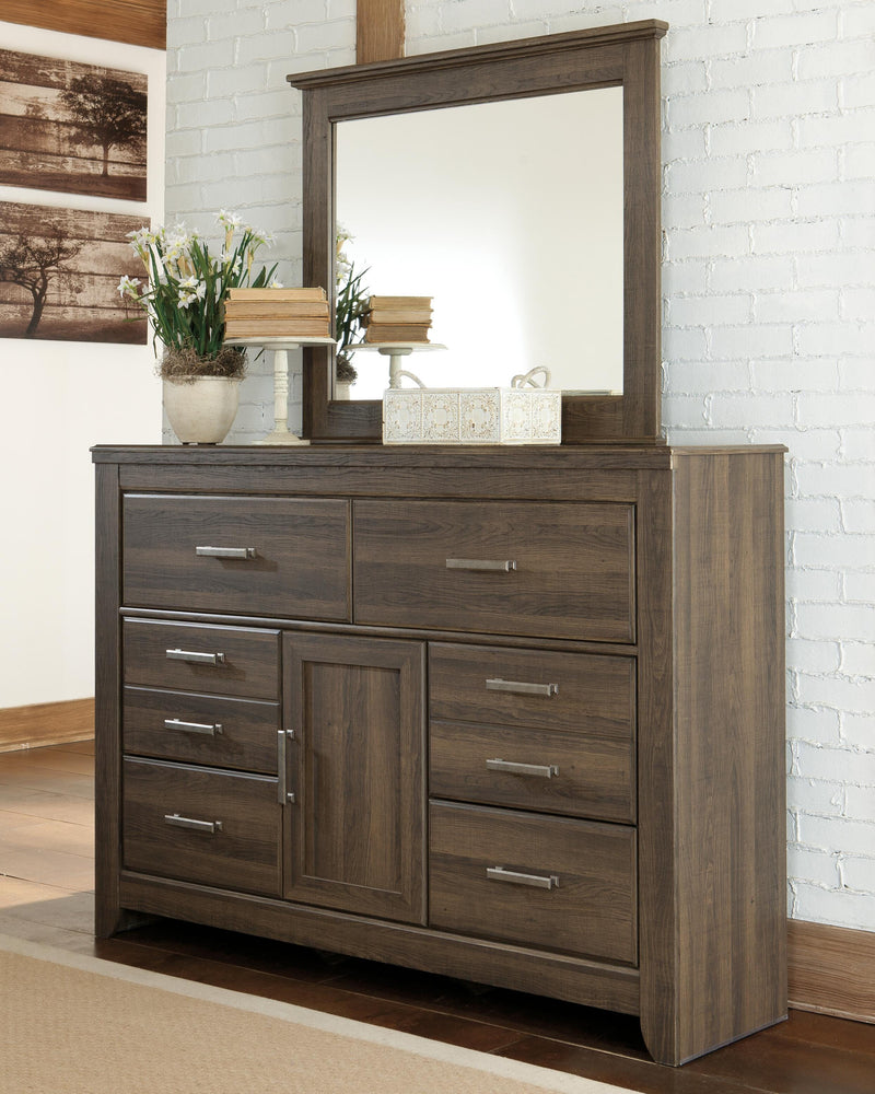 Ashley Furniture Juararo bedroom set with bed, nightstands, and dresser, shown in a modern bedroom setting.