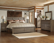 Ashley Furniture Juararo bedroom set includes a bed frame, dresser, and nightstands with wood finish and classic design.