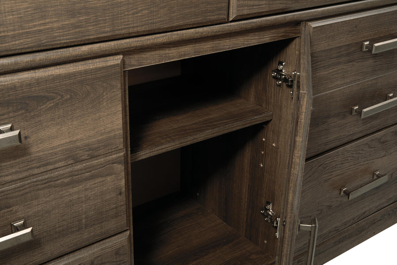 Ashley Furniture Juararo bedroom set featuring a modern bed frame, matching nightstands, and stylish decor in a cozy bedroom setting.