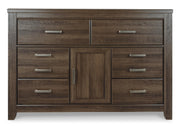 Ashley Furniture Juararo dresser with sleek wood finish and modern design, featuring multiple drawers for ample storage.